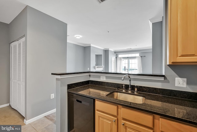 kitchen featuring dark stone countertops, dishwashing machine, ornamental molding, a sink, and baseboards