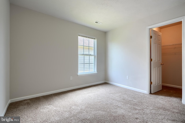 724 Tinker Rd, Middle River, MD 21220 - unfurnished bedroom featuring carpet flooring, baseboards, multiple windows, and a spacious closet