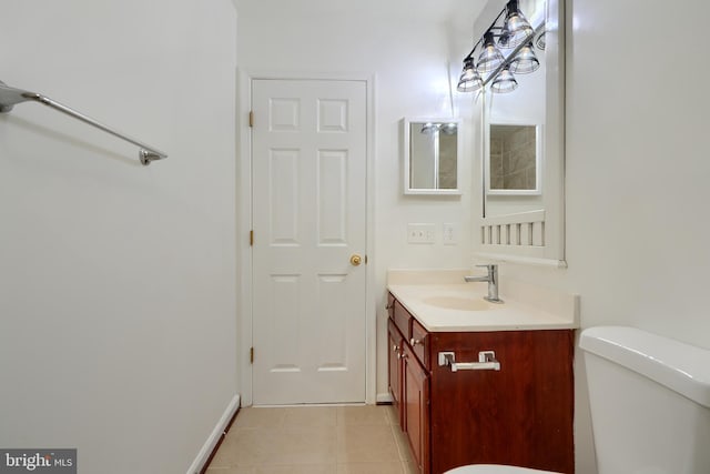 724 Tinker Rd, Middle River, MD 21220 - bathroom featuring vanity, toilet, tile patterned flooring, and baseboards