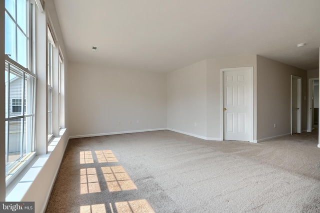 724 Tinker Rd, Middle River, MD 21220 - carpeted spare room with healthy amount of natural light and baseboards