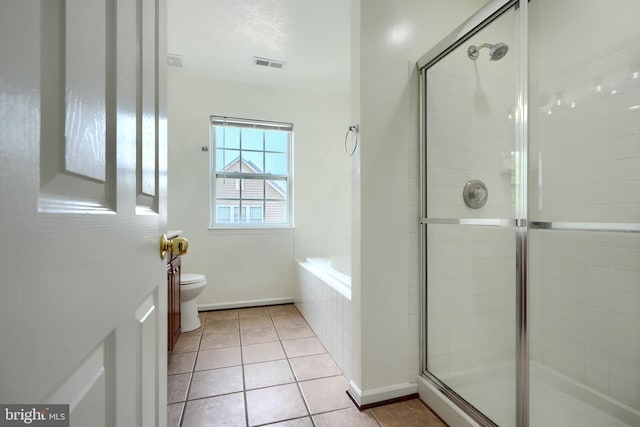 724 Tinker Rd, Middle River, MD 21220 - bathroom with a stall shower, toilet, a garden tub, and tile patterned floors