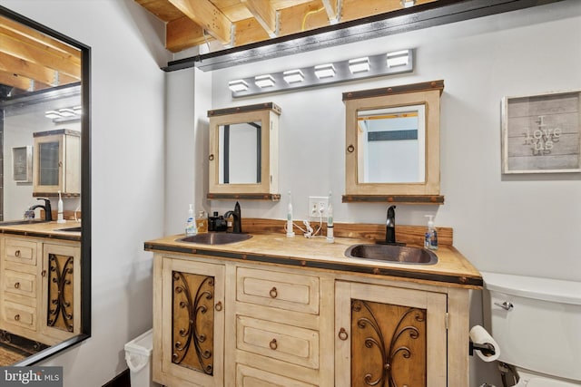 810 N Hancock St Unit 5, Philadelphia, PA 19123 - full bathroom featuring double vanity, toilet, beamed ceiling, and a sink