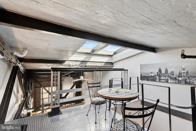 810 N Hancock St Unit 5, Philadelphia, PA 19123 - dining space featuring lofted ceiling with skylight