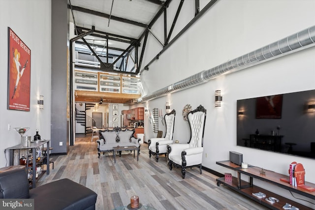 810 N Hancock St Unit 5, Philadelphia, PA 19123 - living room with baseboards, a high ceiling, and wood finished floors