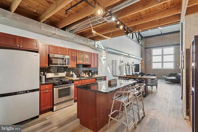 810 N Hancock St Unit 5, Philadelphia, PA 19123 - kitchen featuring dark countertops, appliances with stainless steel finishes, and wood ceiling