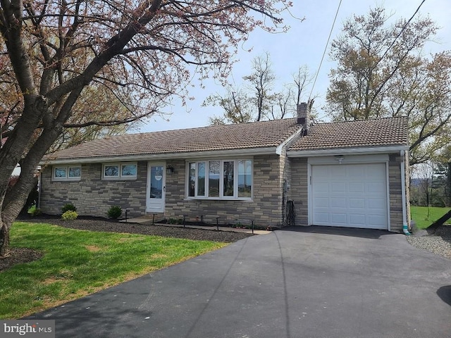 322 Bertolet Mill Rd, Oley, PA 19547 - single story home featuring a tiled roof, stone siding, a chimney, an attached garage, and aphalt driveway