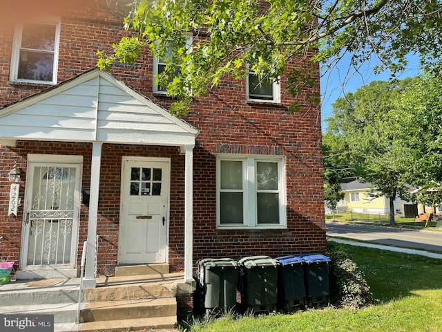 exterior space with brick siding