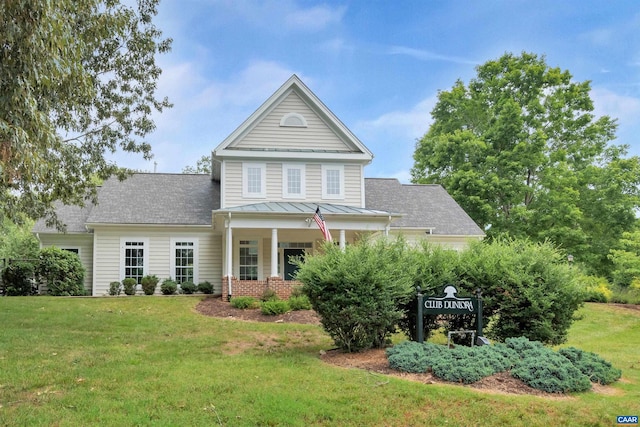 2033 Shepherds Ridge Rd, Charlottesville, VA 22901 - traditional home featuring a standing seam roof, a porch, metal roof, and a front yard