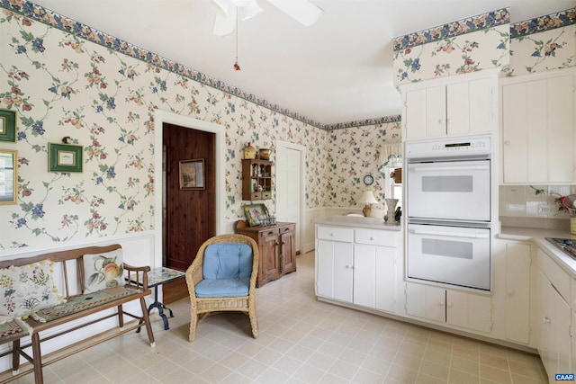 42 Old Farm Rd, Charlottesville, VA 22903 - kitchen with light countertops, wallpapered walls, white double oven, and ceiling fan