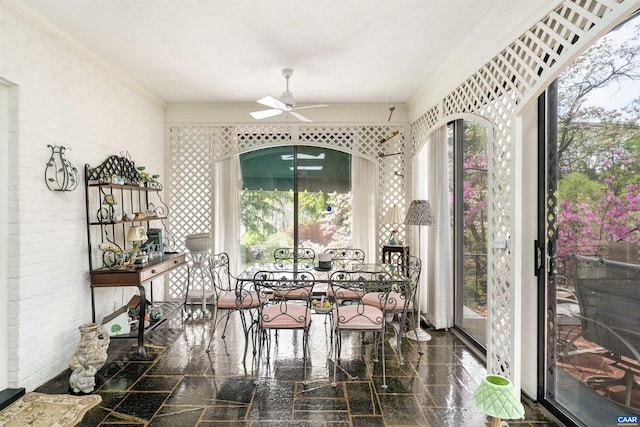 42 Old Farm Rd, Charlottesville, VA 22903 - dining room with ornamental molding, ceiling fan, brick wall, and granite finish floor