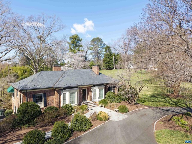 42 Old Farm Rd, Charlottesville, VA 22903 - view of front of house with brick siding, a high end roof, a chimney, and aphalt driveway