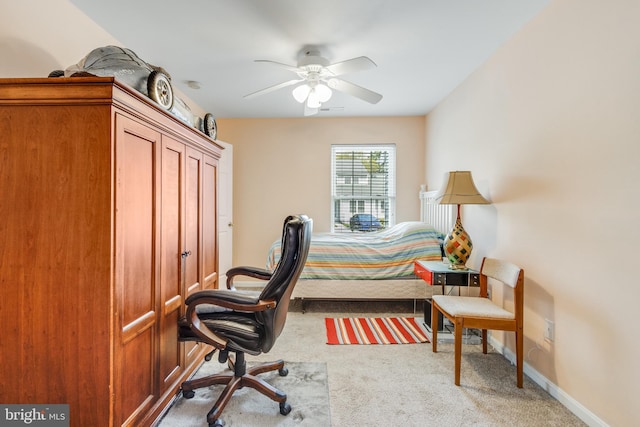 bedroom with light carpet, baseboards, and ceiling fan