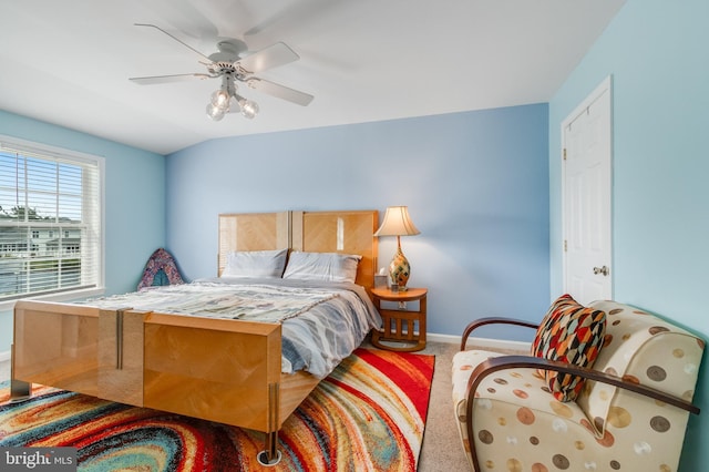 carpeted bedroom featuring a ceiling fan and baseboards