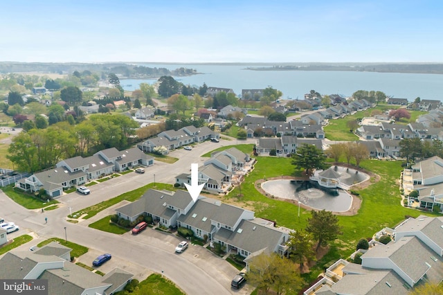aerial view featuring a residential view and a water view