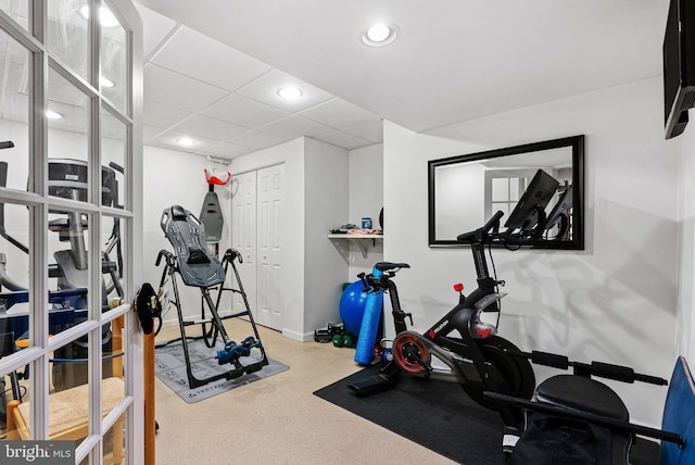 exercise room with recessed lighting and baseboards