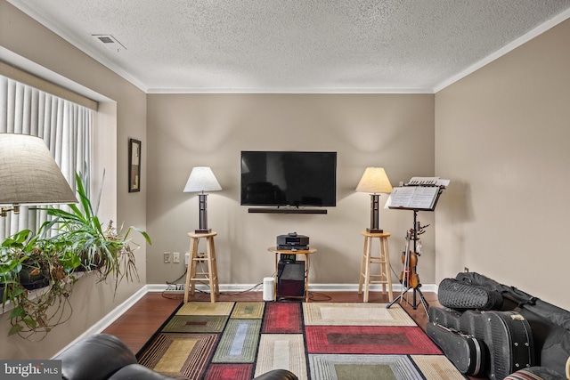 108 Shoreline Dr, Atco, NJ 08004 - living area with wood finished floors, a textured ceiling, crown molding, and baseboards
