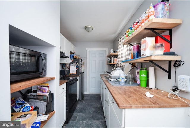 235 Maple St, Reading, PA 19602 - kitchen with open shelves, white cabinets, under cabinet range hood, and black appliances