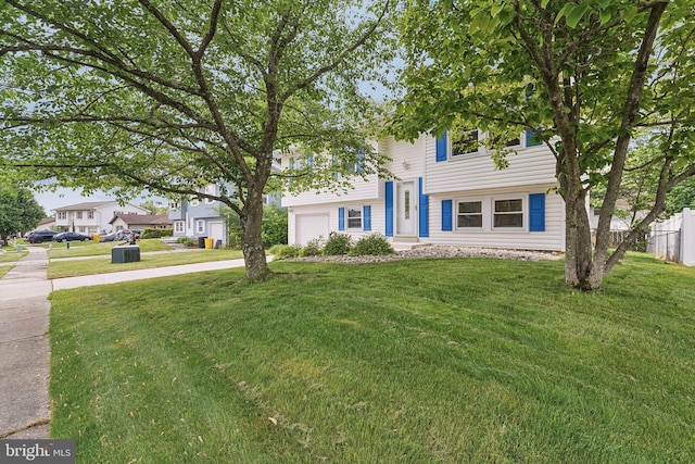view of front facade featuring an attached garage and driveway