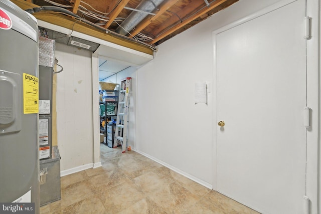 below grade area with baseboards and heating unit