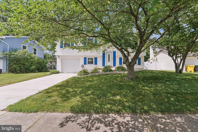obstructed view of property with driveway and a garage