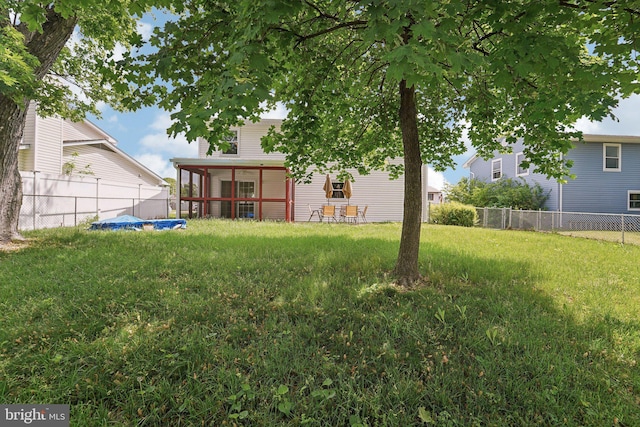 view of yard featuring a sunroom