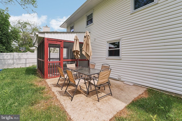 view of patio featuring a sunroom