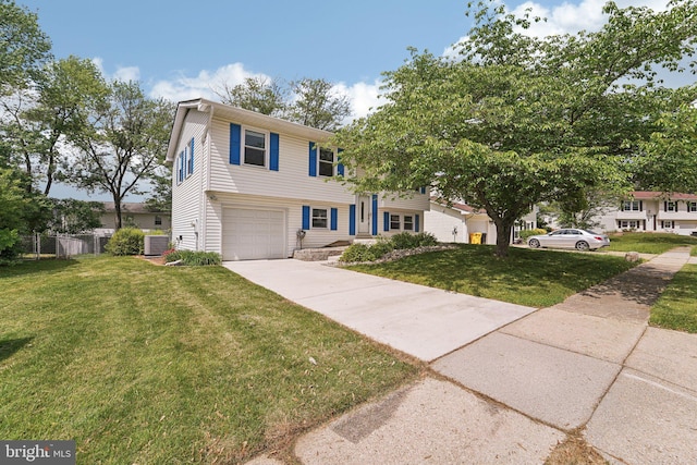 view of front facade featuring an attached garage, concrete driveway, and central AC