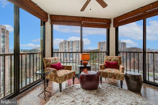 sunroom / solarium with a city view, tile patterned flooring, and a healthy amount of sunlight