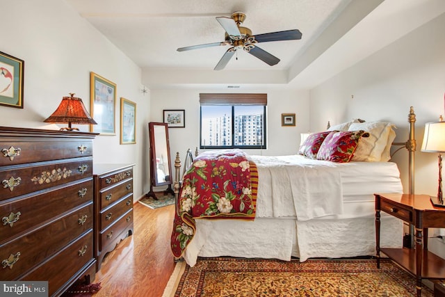 bedroom featuring ceiling fan and wood finished floors