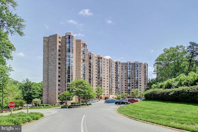 view of property featuring uncovered parking