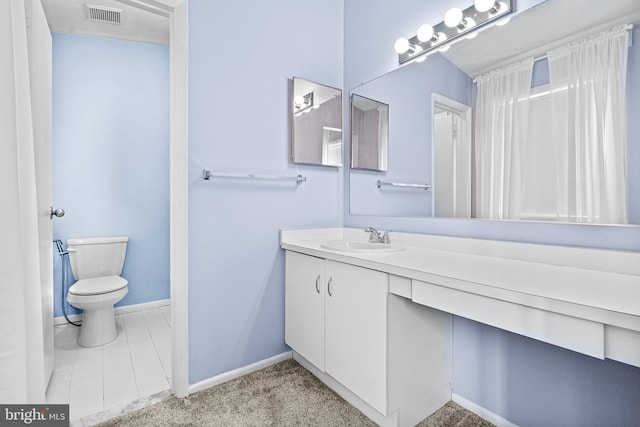 8004 Valley Manor Rd Unit 3C, Owings Mills, MD 21117 - bathroom featuring vanity, toilet, baseboards, and visible vents