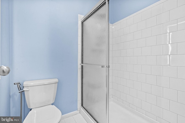 8004 Valley Manor Rd Unit 3C, Owings Mills, MD 21117 - bathroom with tile patterned floors, toilet, baseboards, and a shower stall