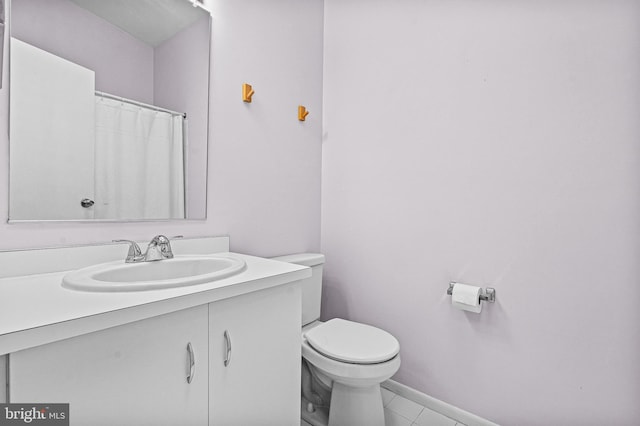 8004 Valley Manor Rd Unit 3C, Owings Mills, MD 21117 - bathroom featuring vanity, toilet, baseboards, and tile patterned floors