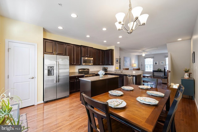 748 S Macon St, Baltimore, MD 21224 - dining room with a chandelier, recessed lighting, light wood finished floors, and a ceiling fan