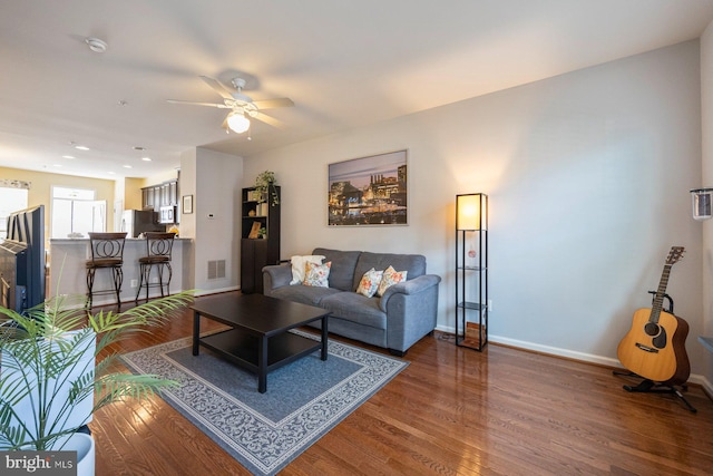 748 S Macon St, Baltimore, MD 21224 - living area featuring wood finished floors, a ceiling fan, baseboards, and recessed lighting