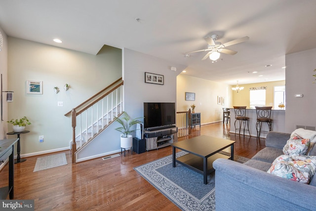 748 S Macon St, Baltimore, MD 21224 - living room with ceiling fan, stairway, wood finished floors, recessed lighting, and baseboards