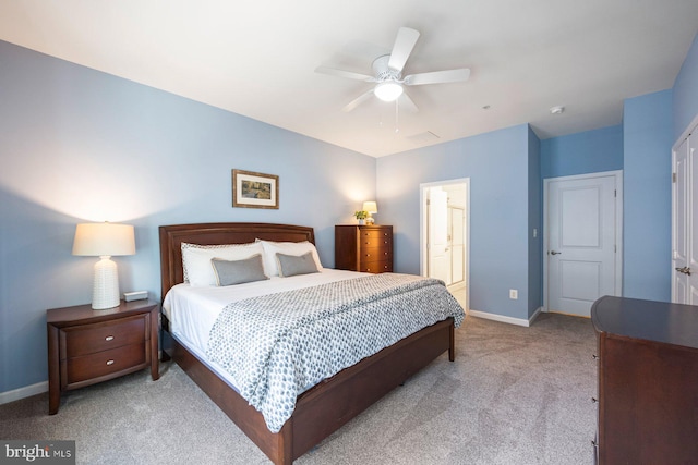 748 S Macon St, Baltimore, MD 21224 - bedroom with carpet, baseboards, ceiling fan, and ensuite bathroom