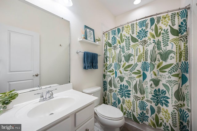748 S Macon St, Baltimore, MD 21224 - bathroom featuring toilet, vanity, and curtained shower
