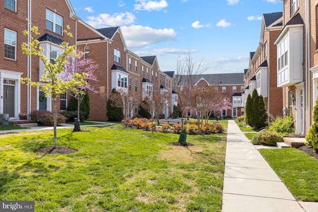 748 S Macon St, Baltimore, MD 21224 - view of home's community with a residential view and a lawn