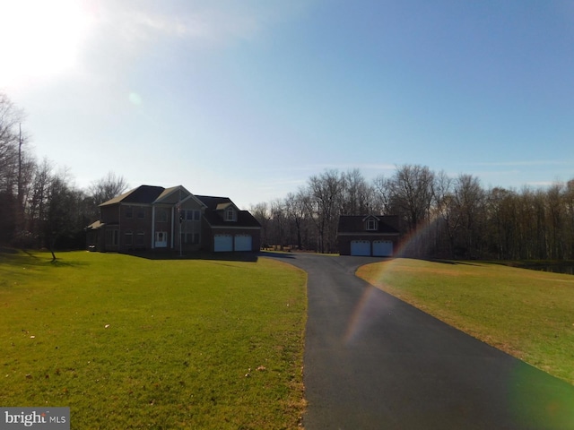 view of road with aphalt driveway