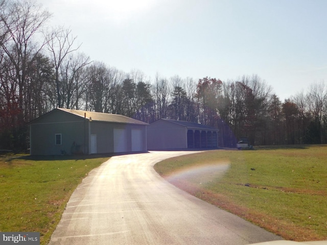 single story home with driveway and a front lawn