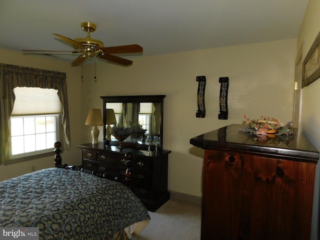 carpeted bedroom featuring ceiling fan