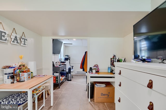 4315 Washington Blvd, Halethorpe, MD 21227 - bedroom featuring light tile patterned floors and a baseboard radiator
