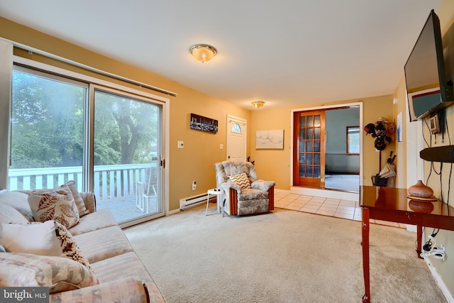 4315 Washington Blvd, Halethorpe, MD 21227 - carpeted living area with a baseboard heating unit, plenty of natural light, and baseboards