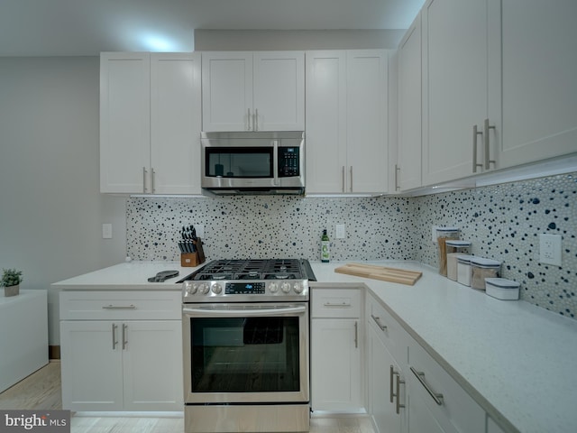 2109 M St NE Unit 5, Washington, DC 20002 - kitchen with stainless steel appliances, light countertops, and backsplash