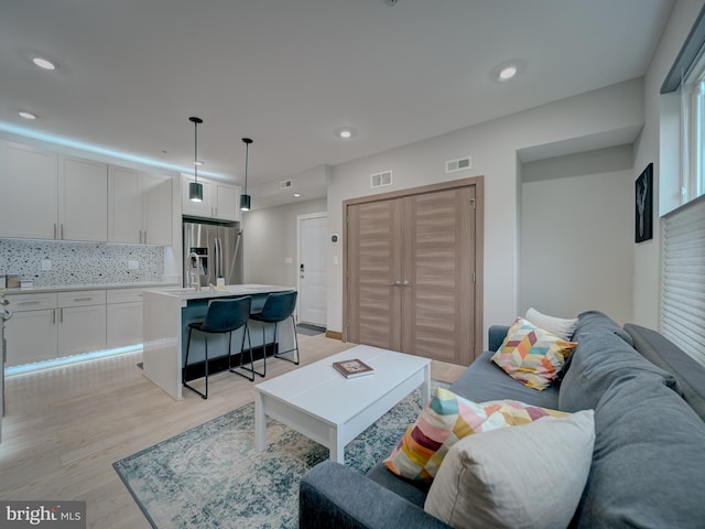 2109 M St NE Unit 5, Washington, DC 20002 - living room with light wood-type flooring and recessed lighting