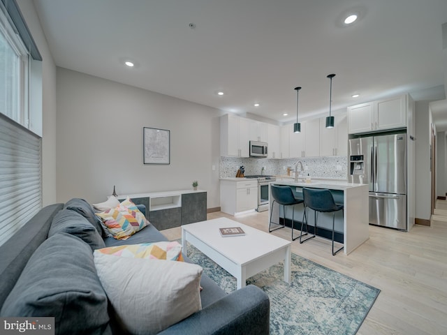 2109 M St NE Unit 5, Washington, DC 20002 - living room with light wood-style flooring and recessed lighting