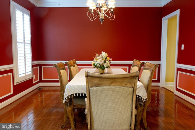 3701 Spicebush Way, Frederick, MD 21704 - dining area featuring a chandelier, hardwood / wood-style floors, crown molding, wainscoting, and baseboards