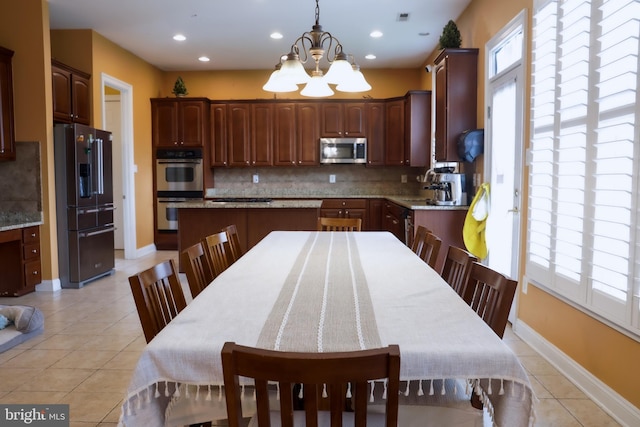 3701 Spicebush Way, Frederick, MD 21704 - kitchen with appliances with stainless steel finishes, tasteful backsplash, light tile patterned floors, healthy amount of natural light, and recessed lighting