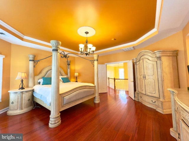 3701 Spicebush Way, Frederick, MD 21704 - bedroom featuring a tray ceiling, baseboards, dark wood-type flooring, a chandelier, and crown molding